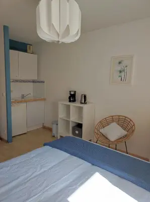 Un ou plusieurs lits dans un hébergement de l'établissement Les Jasmins d'Aytré