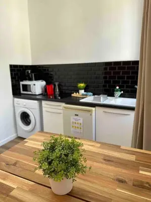 Cuisine ou kitchenette dans l'établissement Les Arches