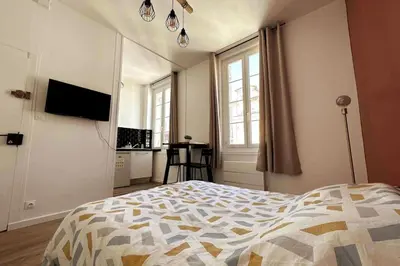 Télévision ou salle de divertissement dans l'établissement Les Arches