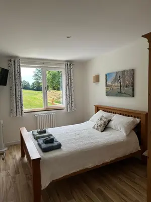 Un ou plusieurs lits dans un hébergement de l'établissement Gîte de la ferme L'Archerie