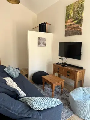 Télévision ou salle de divertissement dans l'établissement Gîte de la ferme L'Archerie