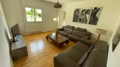 Coin salon dans l'établissement Maison de la vallée