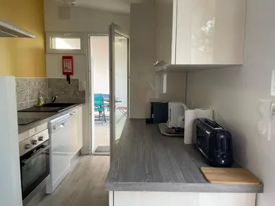Cuisine ou kitchenette dans l'établissement Etang et Famille - Sherlock