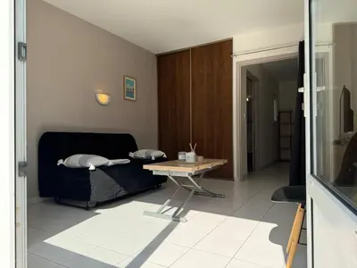 Coin salon dans l'établissement Appartement Les vagues dorées - Résidence Kiwi