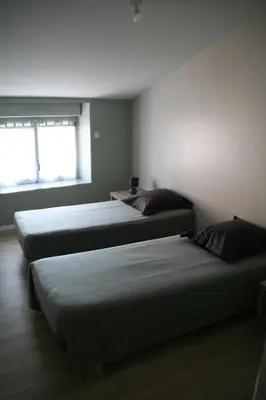 Un ou plusieurs lits dans un hébergement de l'établissement Gîte du Four Banal