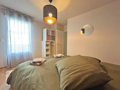 Un ou plusieurs lits dans un hébergement de l'établissement Magnifique appartement vue îles et océan-seaside-