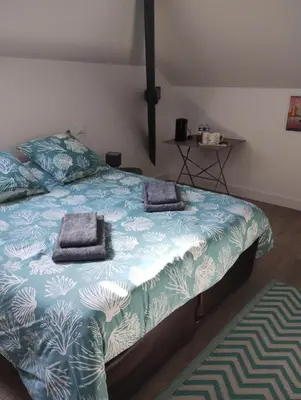 Un ou plusieurs lits dans un hébergement de l'établissement Chambres chez l'habitant proche sortie A10