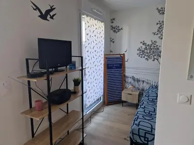 Un ou plusieurs lits dans un hébergement de l'établissement Les Carrelets - Jardin d'Hiver- WIFI-TERRASSE-PAKING