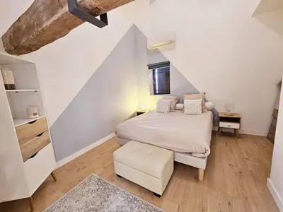 Un ou plusieurs lits dans un hébergement de l'établissement Loft de Magnac, spacieux et moderne