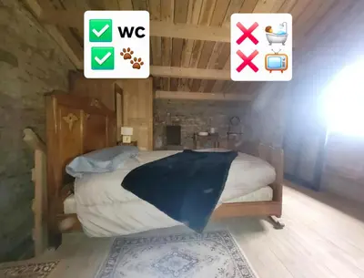 Un ou plusieurs lits dans un hébergement de l'établissement Nuit insolite, chambre au dessus d'une étable