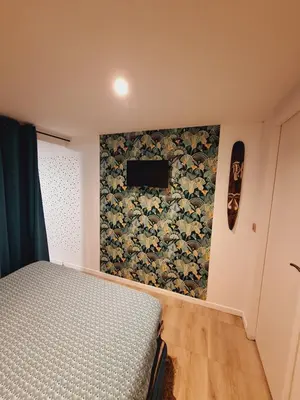 Un ou plusieurs lits dans un hébergement de l'établissement Joli studio 25m2 avec cuisine