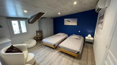 Un ou plusieurs lits dans un hébergement de l'établissement Chambres d'hôtes Les Rozières