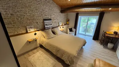 Un ou plusieurs lits dans un hébergement de l'établissement Chambres d'hôtes Les Rozières