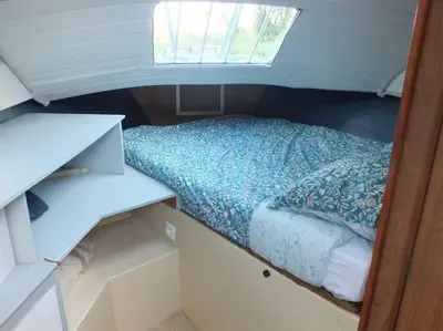 Un ou plusieurs lits dans un hébergement de l'établissement Nuits insolites sur un bateau