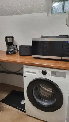 Cuisine ou kitchenette dans l'établissement Duplex KeLi