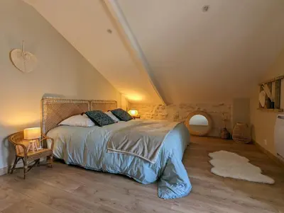 Un ou plusieurs lits dans un hébergement de l'établissement LA VINCELLA Gîte de charme , proche d'Angoulême, 3 chambres