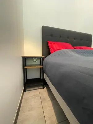 Un ou plusieurs lits dans un hébergement de l'établissement Maison avec grand espace en hauteur
