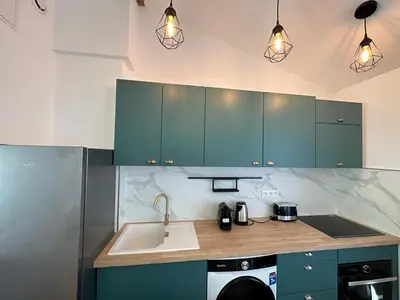 Cuisine ou kitchenette dans l'établissement Appart cosy - belle vue