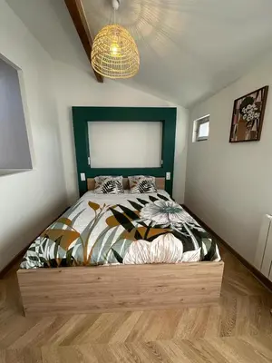 Un ou plusieurs lits dans un hébergement de l'établissement Appart cosy - belle vue