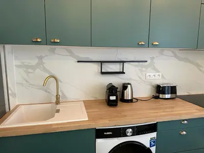 Cuisine ou kitchenette dans l'établissement Appart cosy - belle vue