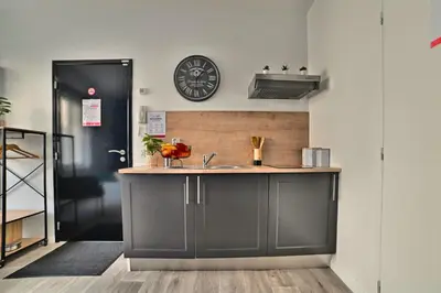 Cuisine ou kitchenette dans l'établissement Paradis Bleu - Coeur de ville, Tv 4K, Netflix, Fibre, Confortable, Calme