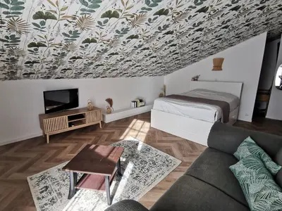Télévision ou salle de divertissement dans l'établissement Épi Cottage