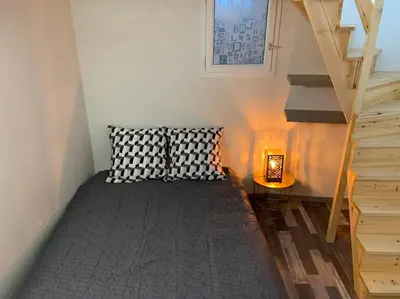 Un ou plusieurs lits dans un hébergement de l'établissement Le cocon T2 duplex 24 m2