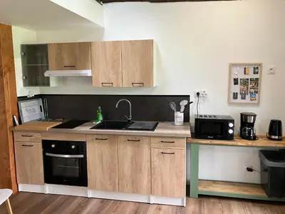 Cuisine ou kitchenette dans l'établissement Le Pressoir