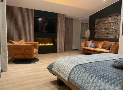 Coin salon dans l'établissement Logement spa privatif proche Niort et La Rochelle
