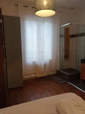 Un ou plusieurs lits dans un hébergement de l'établissement Charmant T2 place de Verdun
