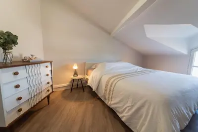 Un ou plusieurs lits dans un hébergement de l'établissement Le Petit Verger, cosy 5 people