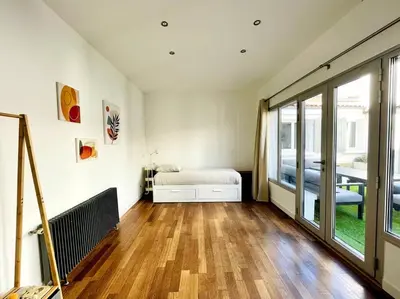 Un ou plusieurs lits dans un hébergement de l'établissement Casa Rochelaise - Jacuzzi