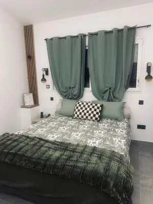 Un ou plusieurs lits dans un hébergement de l'établissement Chambre confort