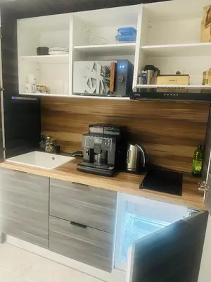 Cuisine ou kitchenette dans l'établissement Chambre confort