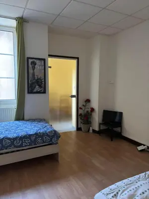 Un ou plusieurs lits dans un hébergement de l'établissement Appartement pour 5 à 7 personnes