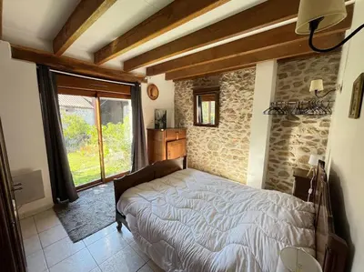 Un ou plusieurs lits dans un hébergement de l'établissement Maison Périgourdine 14 personnes avec piscine