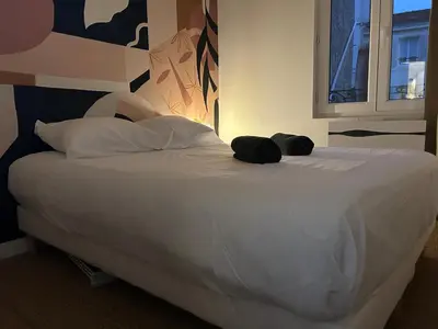 Un ou plusieurs lits dans un hébergement de l'établissement Bel Appartement Duck, Centre, Sèvres