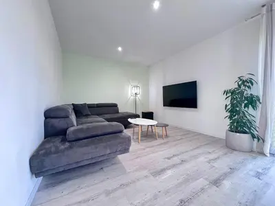 Coin salon dans l'établissement MAISON DE OSIER-JUSQU'A 6 PERSONNES-WIFi