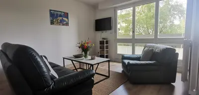 Coin salon dans l'établissement Grand 95m, 4ch, Plateau 5min, Parking, 8p