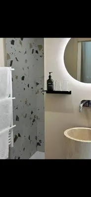 Salle de bains dans l'établissement La Maison du Jardin