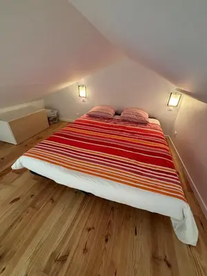 Un ou plusieurs lits dans un hébergement de l'établissement Maison proche ville - Chez Marsou