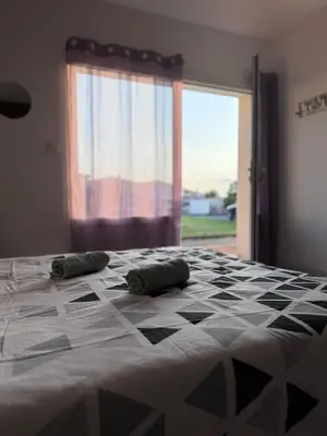 Un ou plusieurs lits dans un hébergement de l'établissement Appartement Lilas - Résidence Kiwi
