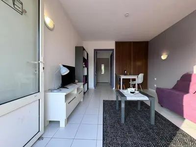 Coin salon dans l'établissement Appartement Lilas - Résidence Kiwi
