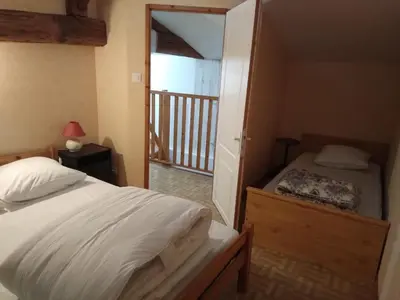 Un ou plusieurs lits dans un hébergement de l'établissement Gîte à la campagne en pays mellois
