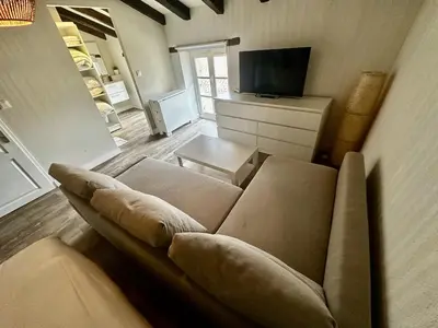 Télévision ou salle de divertissement dans l'établissement Les Arches