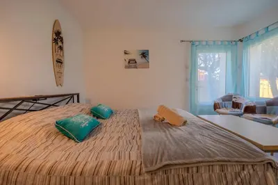 Un ou plusieurs lits dans un hébergement de l'établissement Appartement Dauphin - Résidence Kiwi