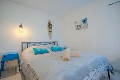 Un ou plusieurs lits dans un hébergement de l'établissement Appartement Dauphin - Résidence Kiwi
