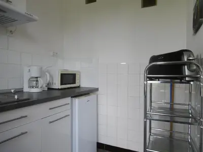 Cuisine ou kitchenette dans l'établissement Appart 1 chambre Montmorillon 12