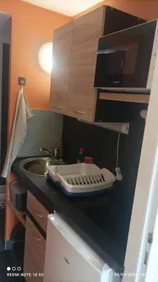 Cuisine ou kitchenette dans l'établissement Lolft 1 PROCHE FUTUROSCOPE