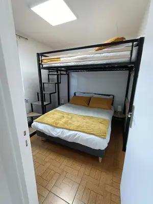 Un ou plusieurs lits dans un hébergement de l'établissement Location des longères